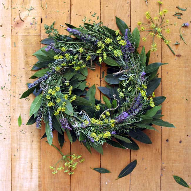 How to make wreath super fast with this dollar store hack! Turn a laundry basket into a wreath jig, plus tutorials on a flower wreath & a herb wreath!