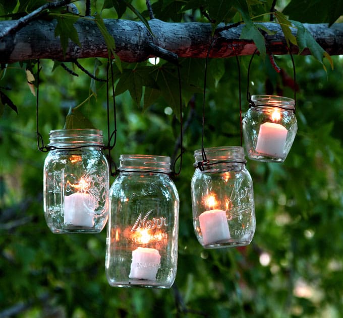 The easiest & super charming DIY hanging mason jar lights using up-cycled glass bottles and dry cleaners wire hangers. Detailed step by step tutorial! - A Piece of Rainbow