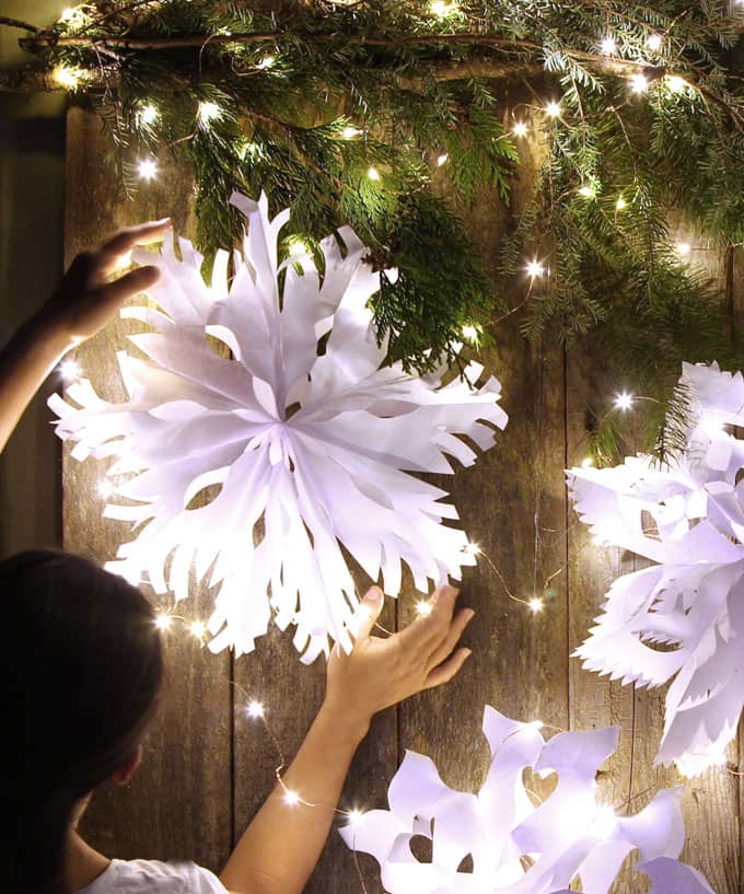 Make giant lighted snowflake pendants from paper bags or white paper. Easy tutorial with free templates. Beautiful decor for holidays and year round! - A Piece of Rainbow