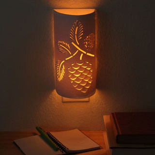 Transform a plain night light into an enchanting paper lantern. Download the flower or pine cone designs to make your own functional art that glows! - A Piece of Rainbow