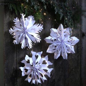 Make giant lighted snowflake pendants from paper bags or white paper. Easy tutorial with free templates. Beautiful decor for holidays and year round! - A Piece of Rainbow