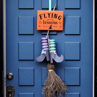 Easy & free DIY Halloween door decoration with "Flying Lessons" free printable sign! Great kids Halloween craft using nature finds & recycled materials.