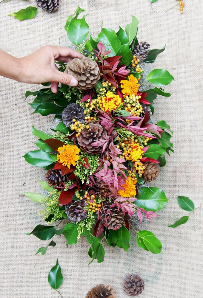 add fall centerpiece accents  fresh fall flowers like mums, small sunflowers, and marigolds, or dried elements such as twigs, seed heads,  moss and pinecones.
