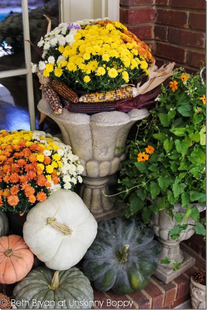 Create beautiful fall planters and pots with pumpkins and flowers