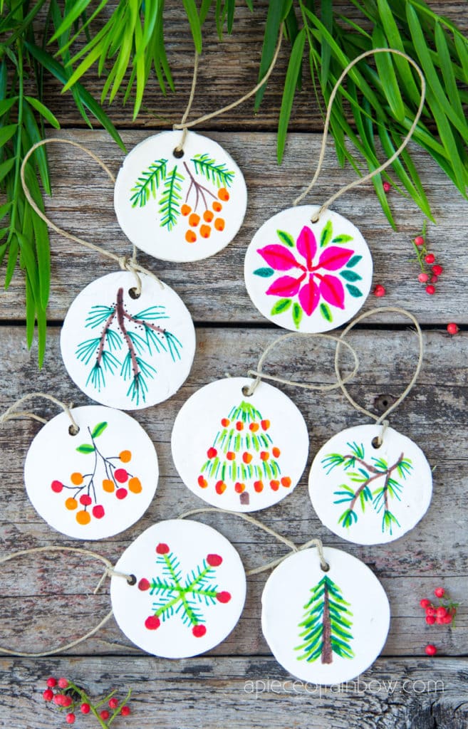 Beautiful DIY air dry clay and salt dough Christmas ornaments using nature finds & watercolor art on homemade clay! Easy and unique holiday crafts, gifts & decorations!