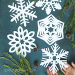How to make beautiful easy paper snowflakes for winter & Christmas decorations! Simple paper crafts for kids & family. 12 best free templates!