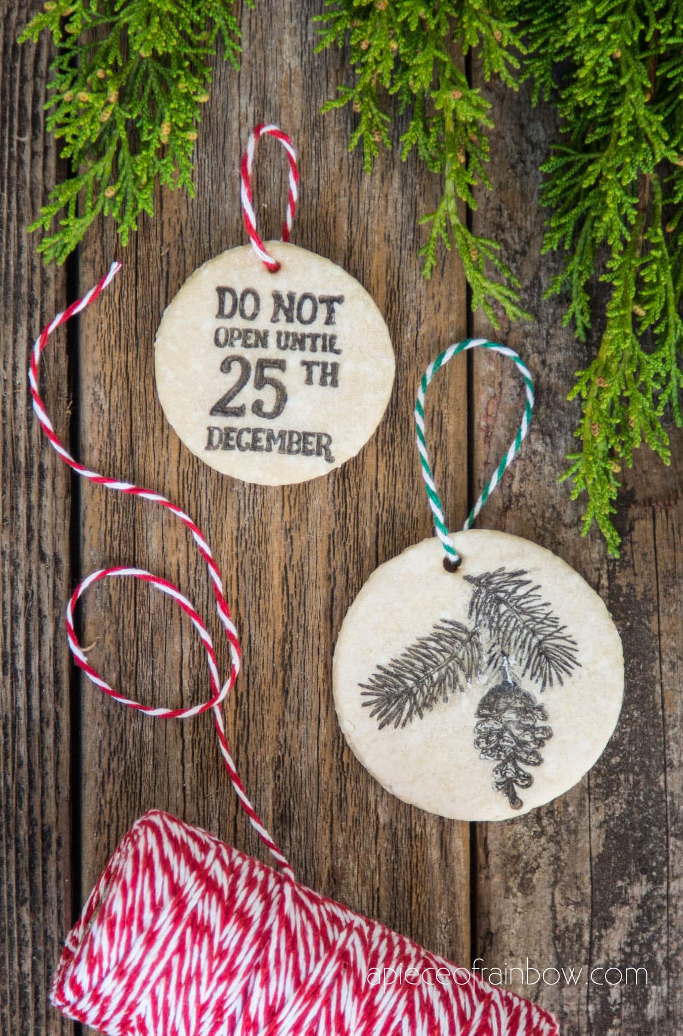 stamped salt dough gift tags with red and white twine for Christmas gift wrapping