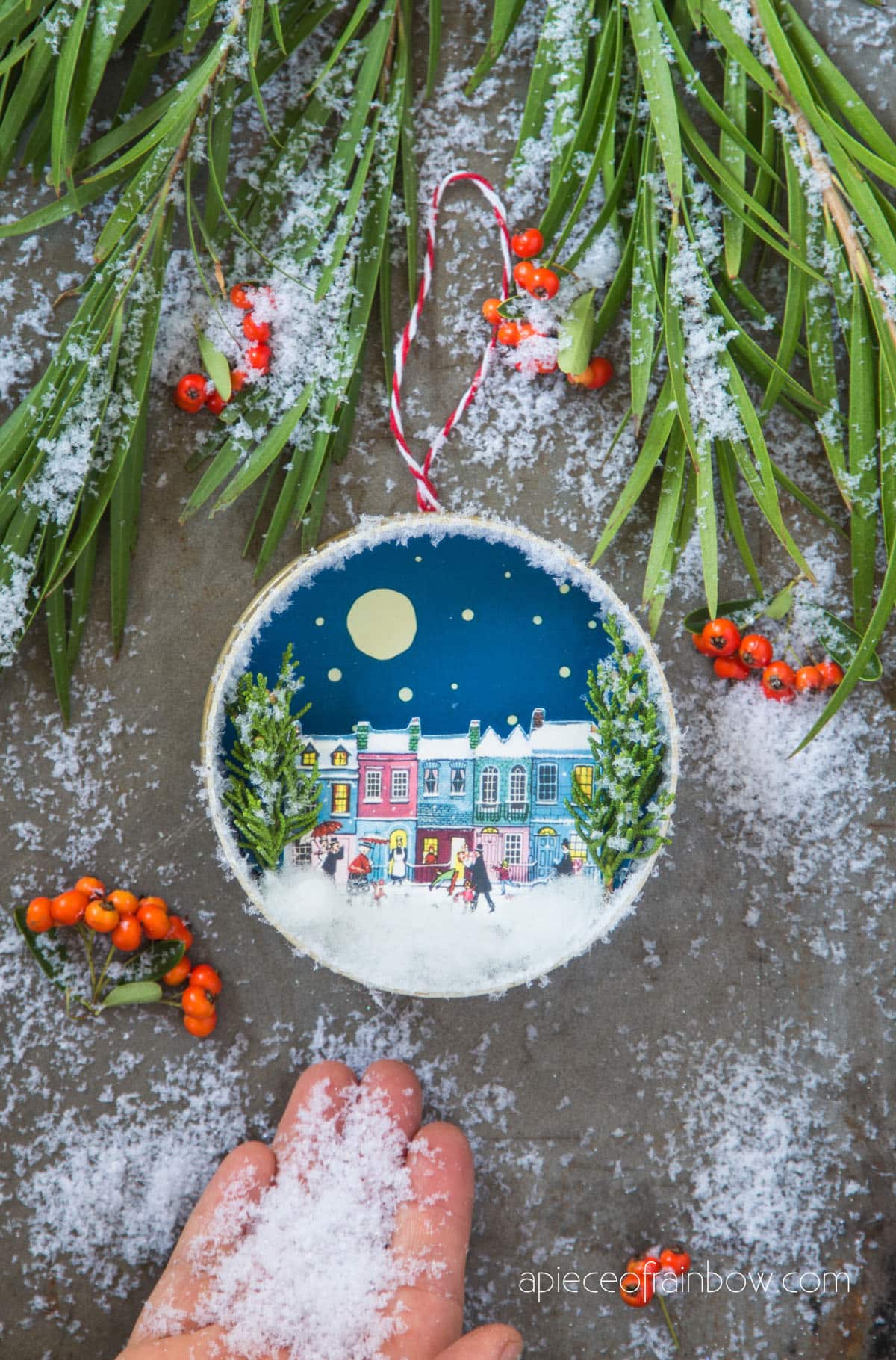 Christmas trees with snowy winter village ornaments 