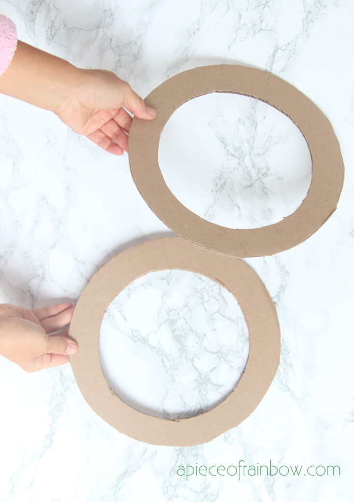cut cardboard rings as wreath forms