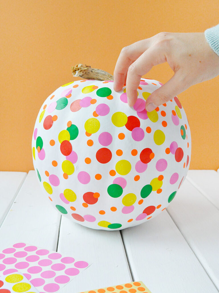 make modern boho pumpkin fall decorations using colorful stickers. 