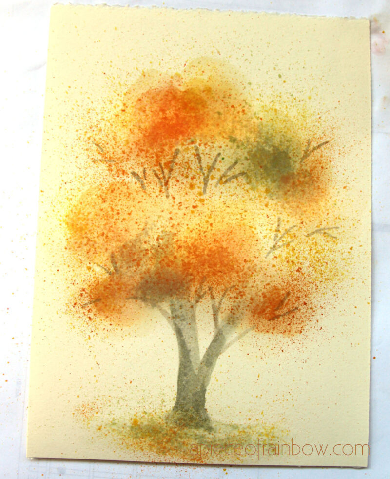 autumn tree painting with watercolor splatters 