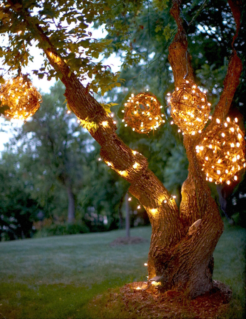 Hanging Christmas light balls made from grapevine