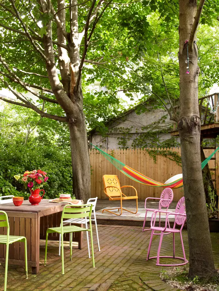 Use trees to create magical outdoor rooms in a backyard