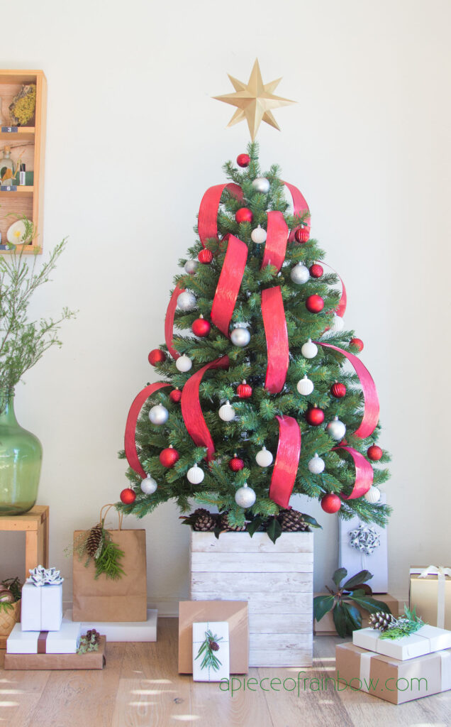 a classic Christmas color combo with 2.5” wide bright red ribbons. Complement with red and white ornaments for a traditional yet sophisticated look