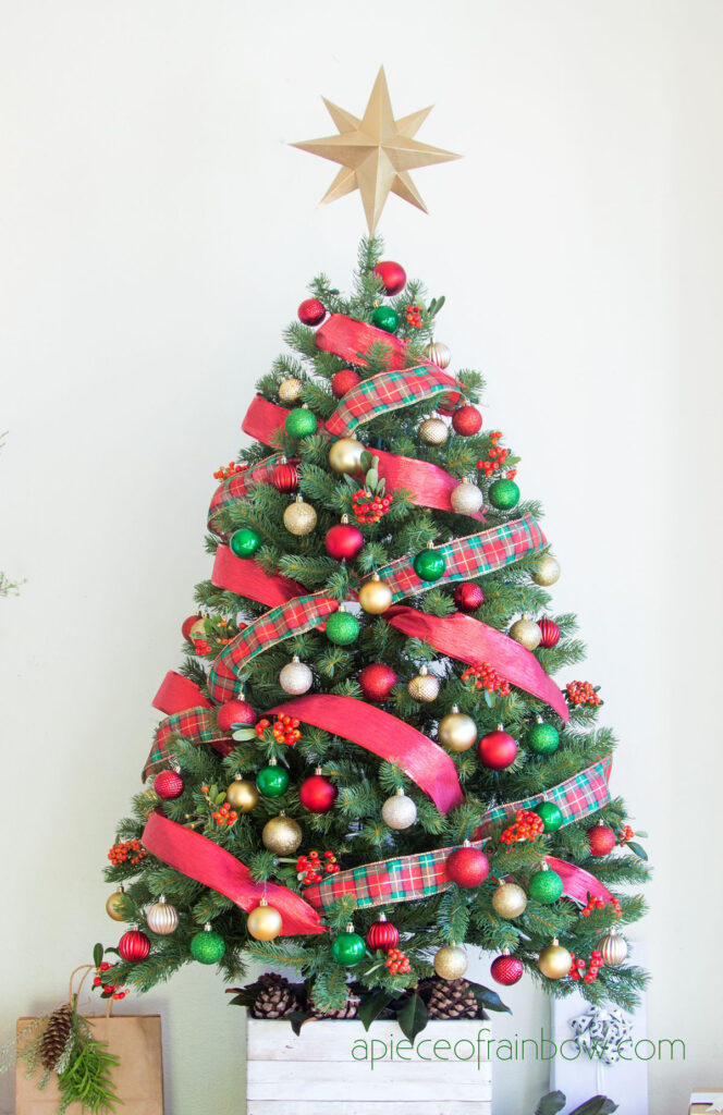 How to decorate a Christmas tree with red, gold, and green plaid ribbons and ornaments