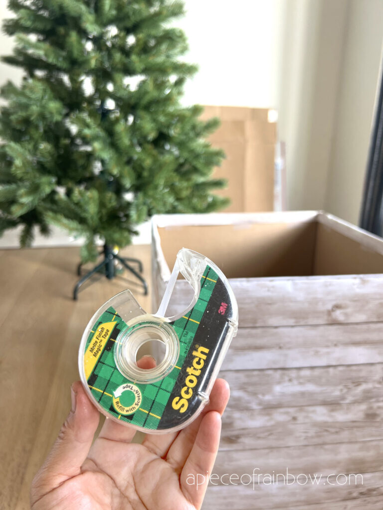 make  Christmas tree box look like rustic white-washed wood