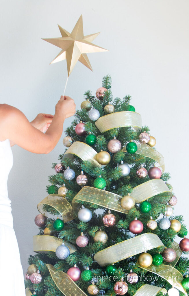 Materials and tools to make paper Christmas star tree topper