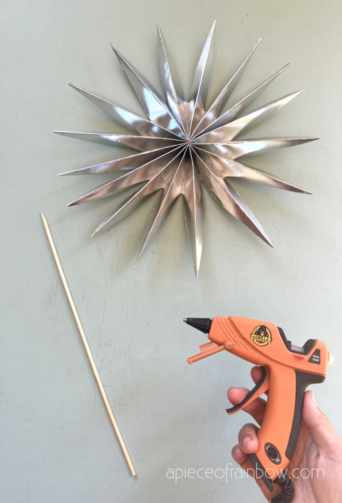  hot glue a stick or long bamboo skewer for Christmas star tree topper